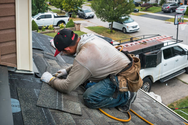 Professional Roofing technician working in South Lee, MA